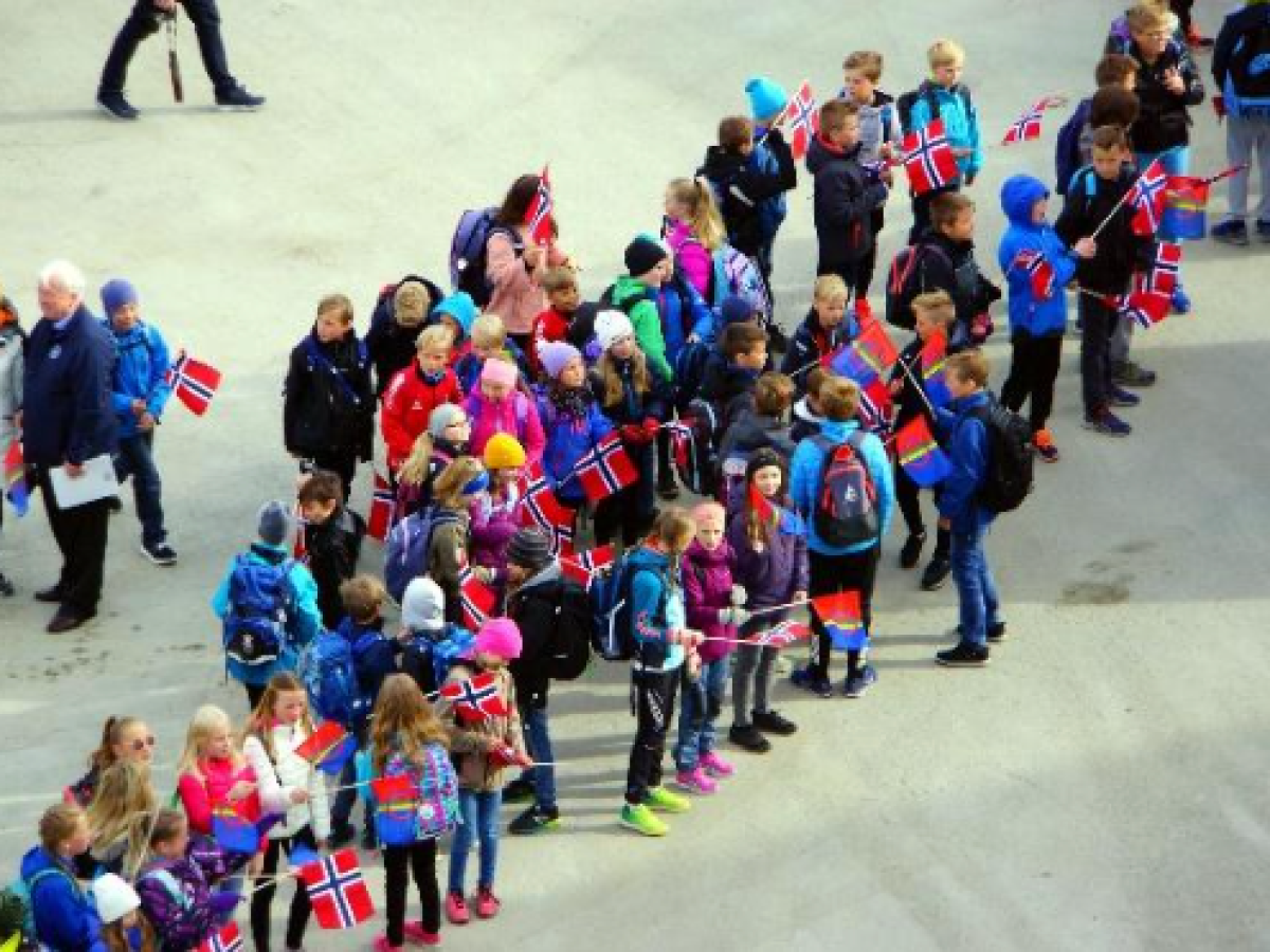 a group of people walking in front of a crowd